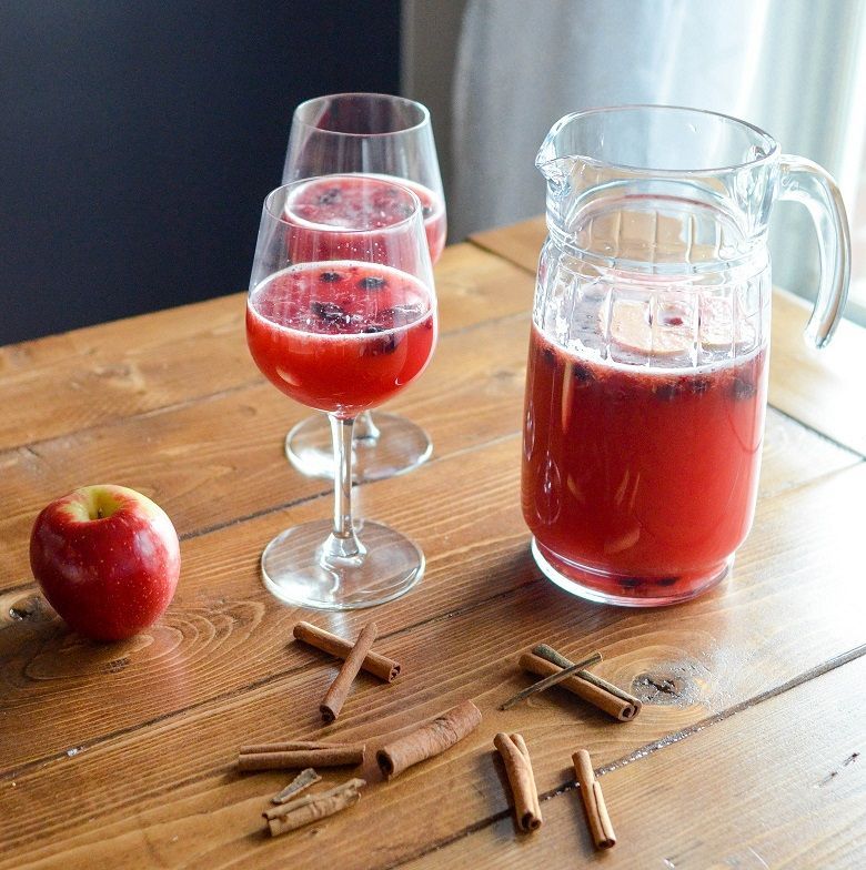 A group of people are sitting in a circle in a room.