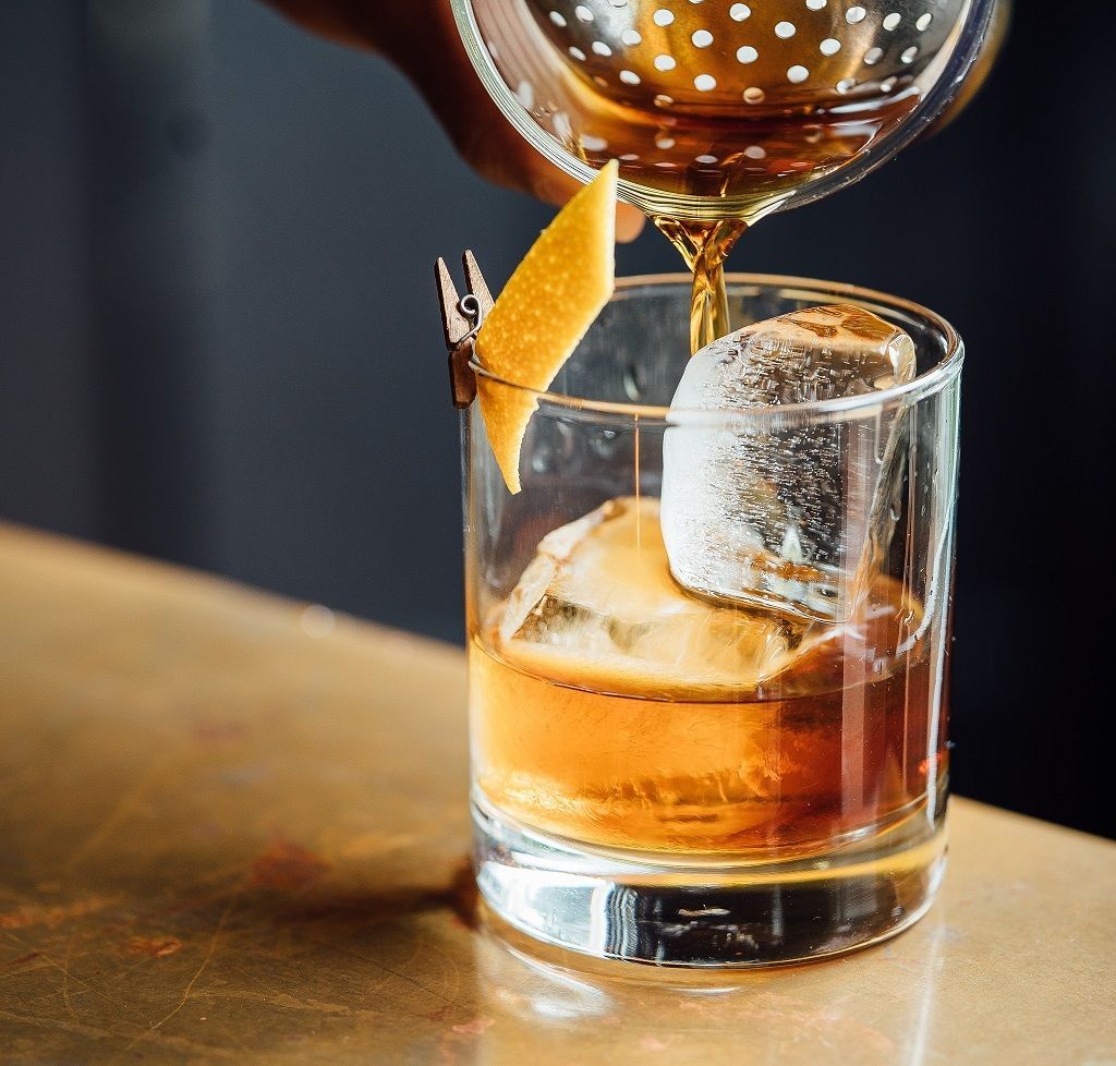 A group of people are sitting in a circle talking to each other.