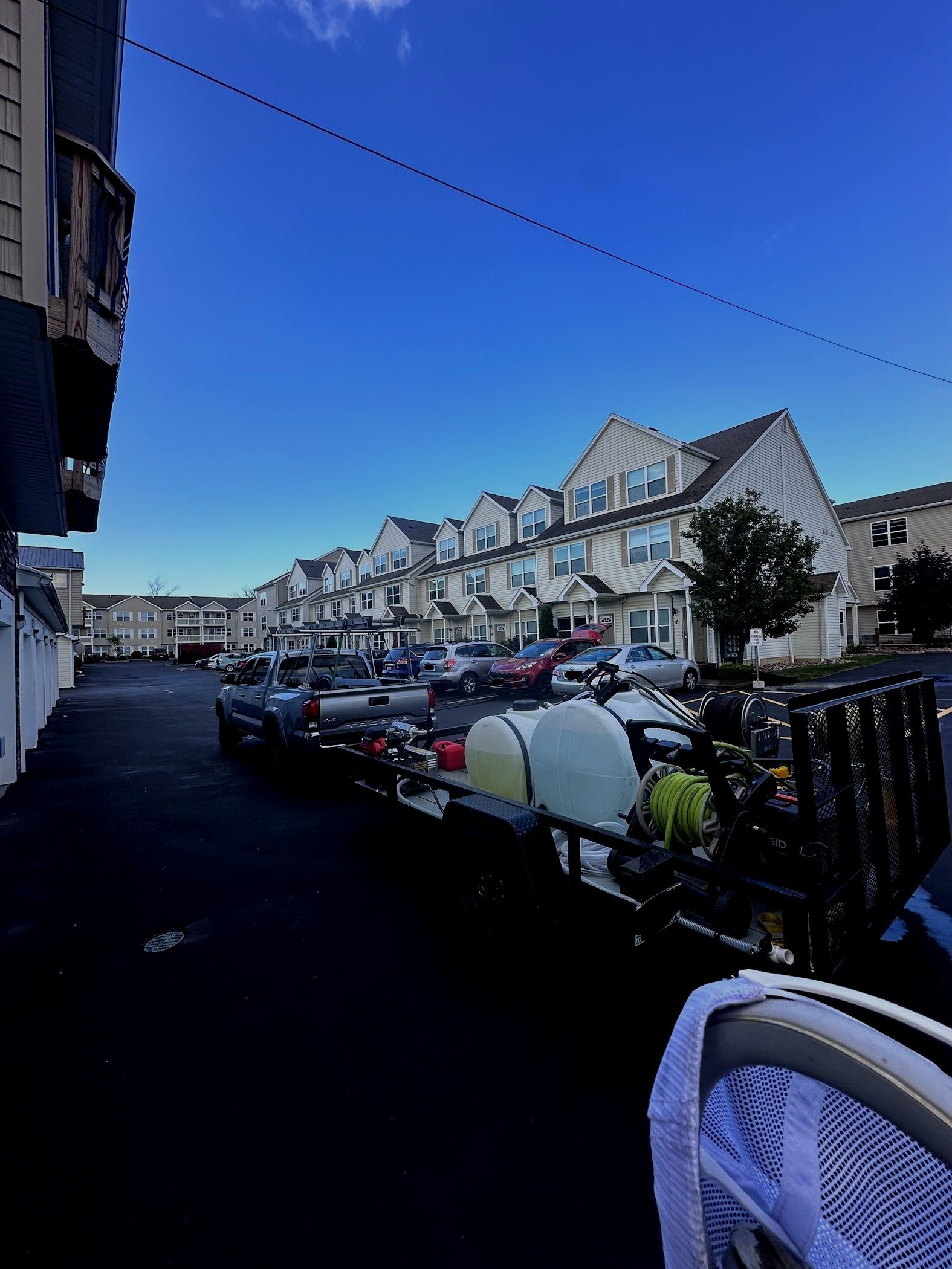 A row of houses with a blue sky in the background