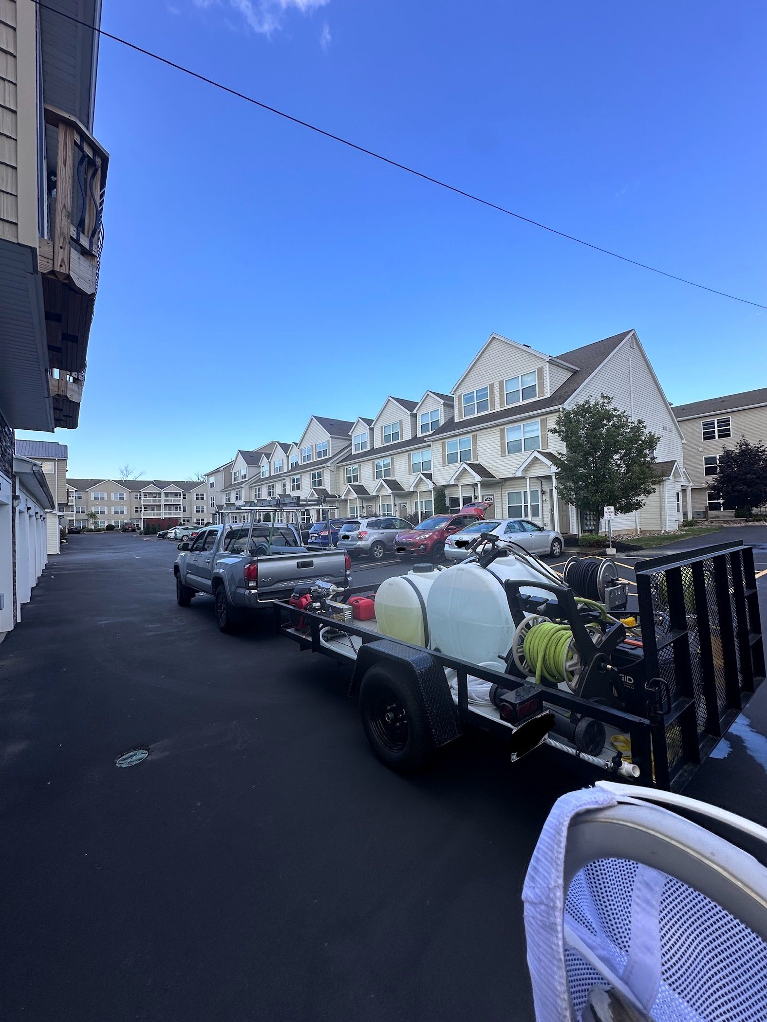 A row of houses with a blue sky in the background