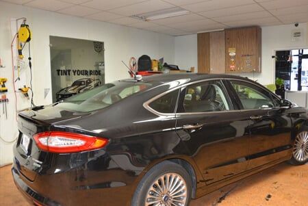 Tinting Window Car — Tinting Window of a Black Car in Lewisville, Texas