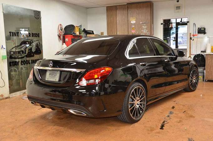 Window Car Shop Film — Window of a Black Car Shop Film in Lewisville, Texas