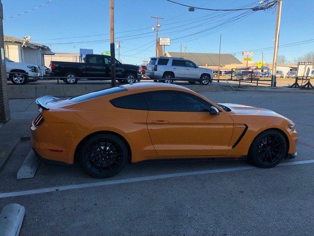 Window Car Tinted — Window of an Orange Car Tinted in Lewisville, Texas