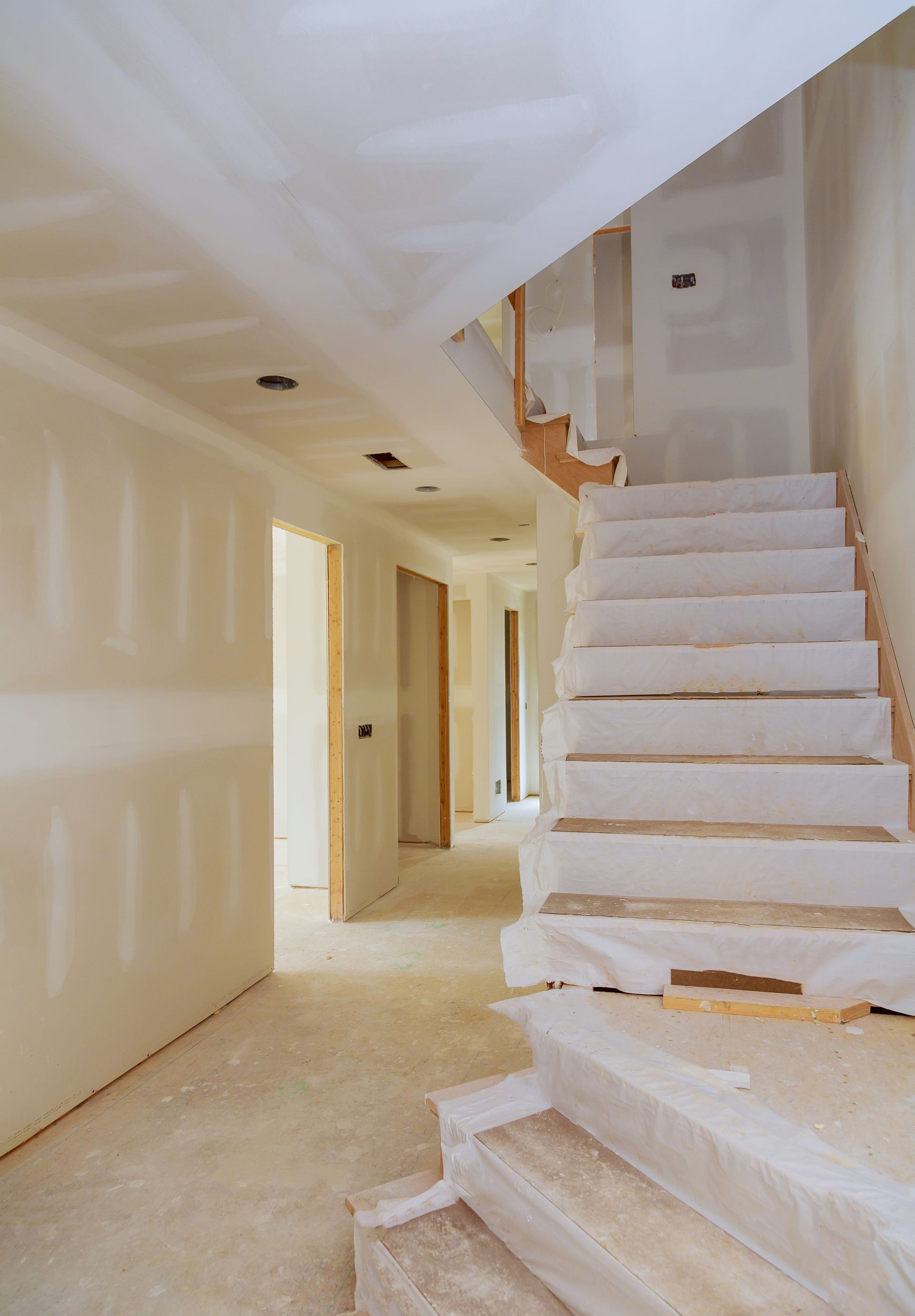 Interior new home construction of housing project with drywall installed