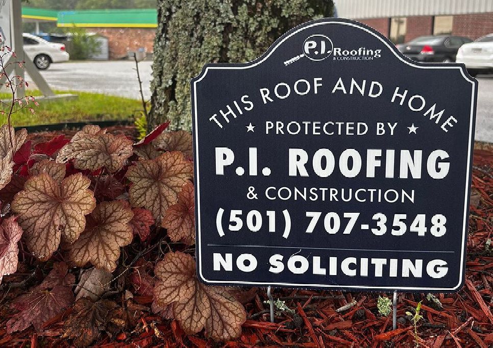 A close up of a roof with trees in the background.
