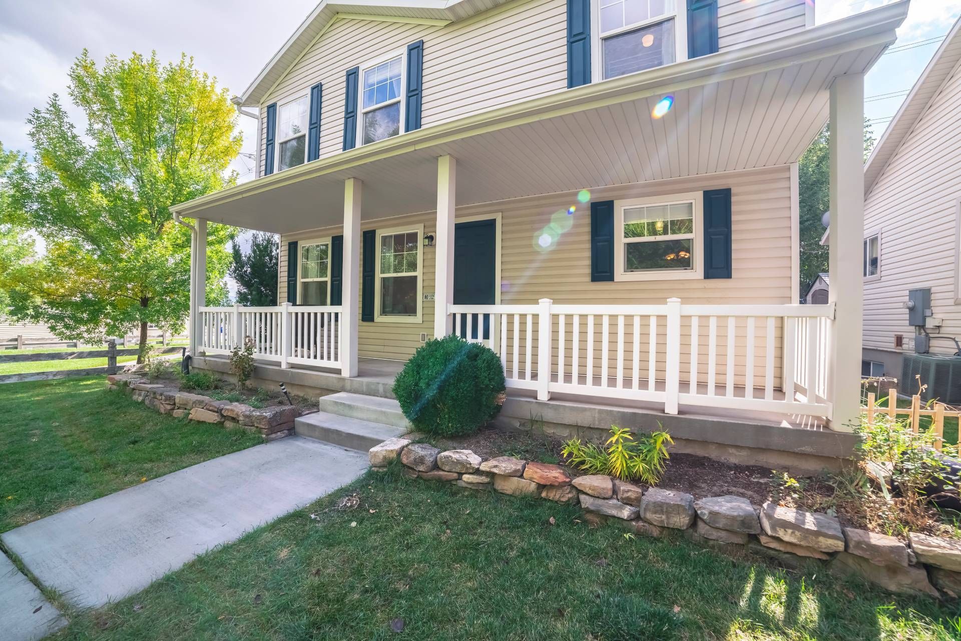 A home with exterior shutters and a front porch at Upstate Window Fashions near Greenville, South Ca