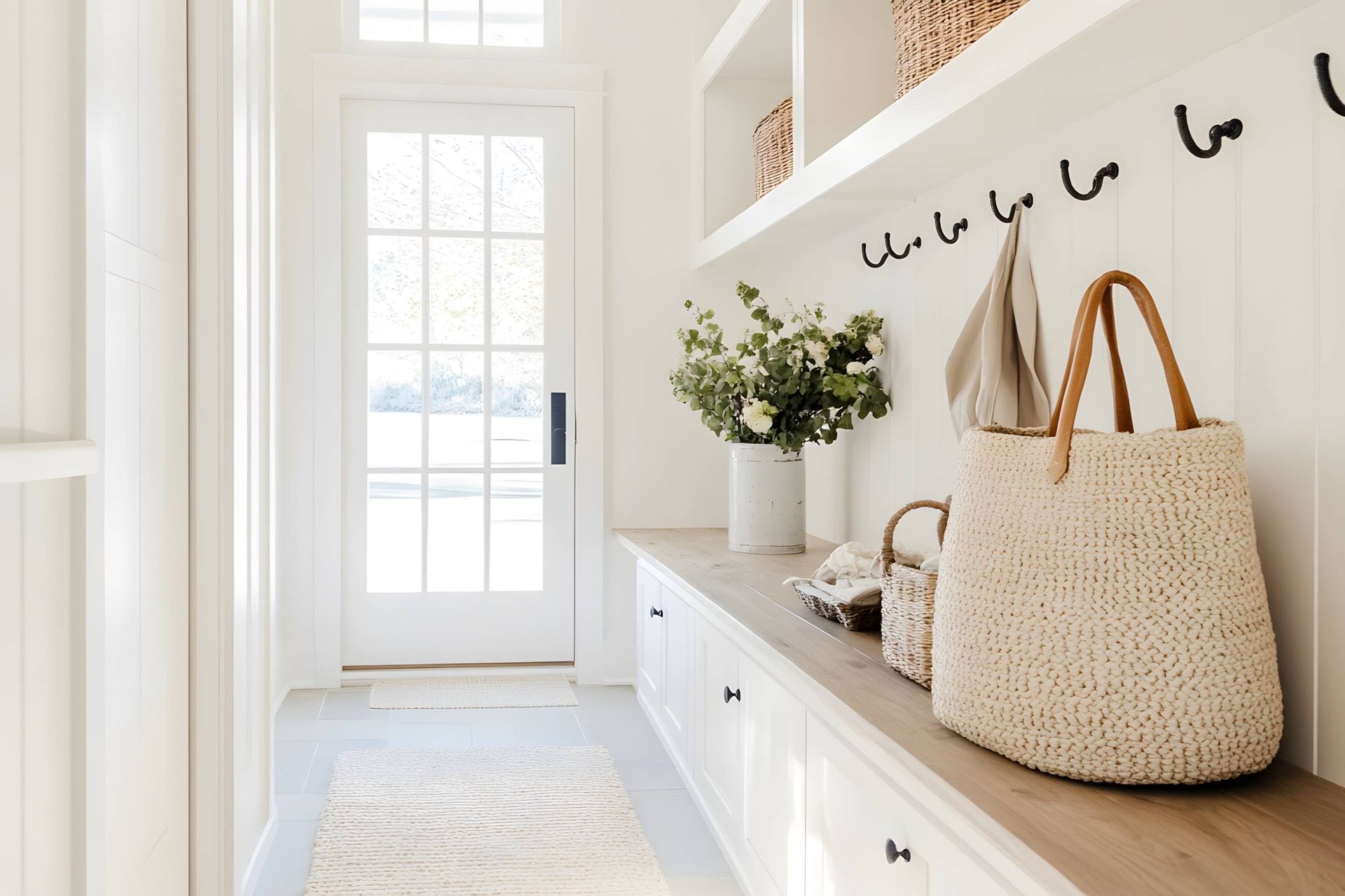 A foyer entryway with storage space and natural decorative elements at Upstate Window Fashions near 