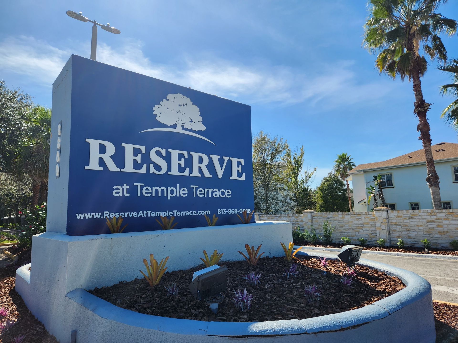 A blue and white sign for reserve at temple terrace