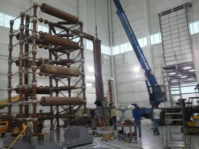 Machinery Transportation — Blue Crane Lifting a Tube in Monroe, NC