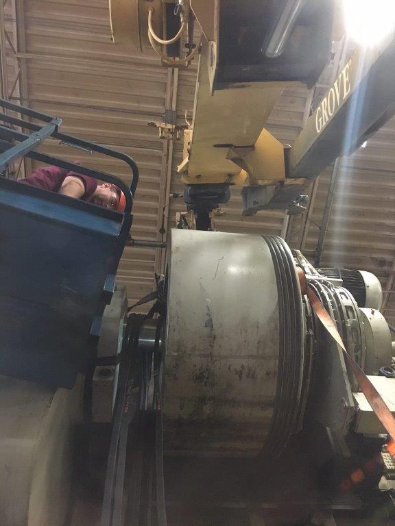 Man Checking Machine — Monroe, NC — Secrest Rigging & Machinery Movers