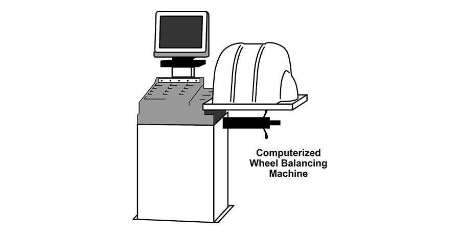A black and white drawing of a computerized wheel balancing machine.