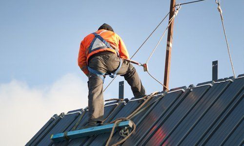 Roofer Working at Heights Covered by OnSite Insurance