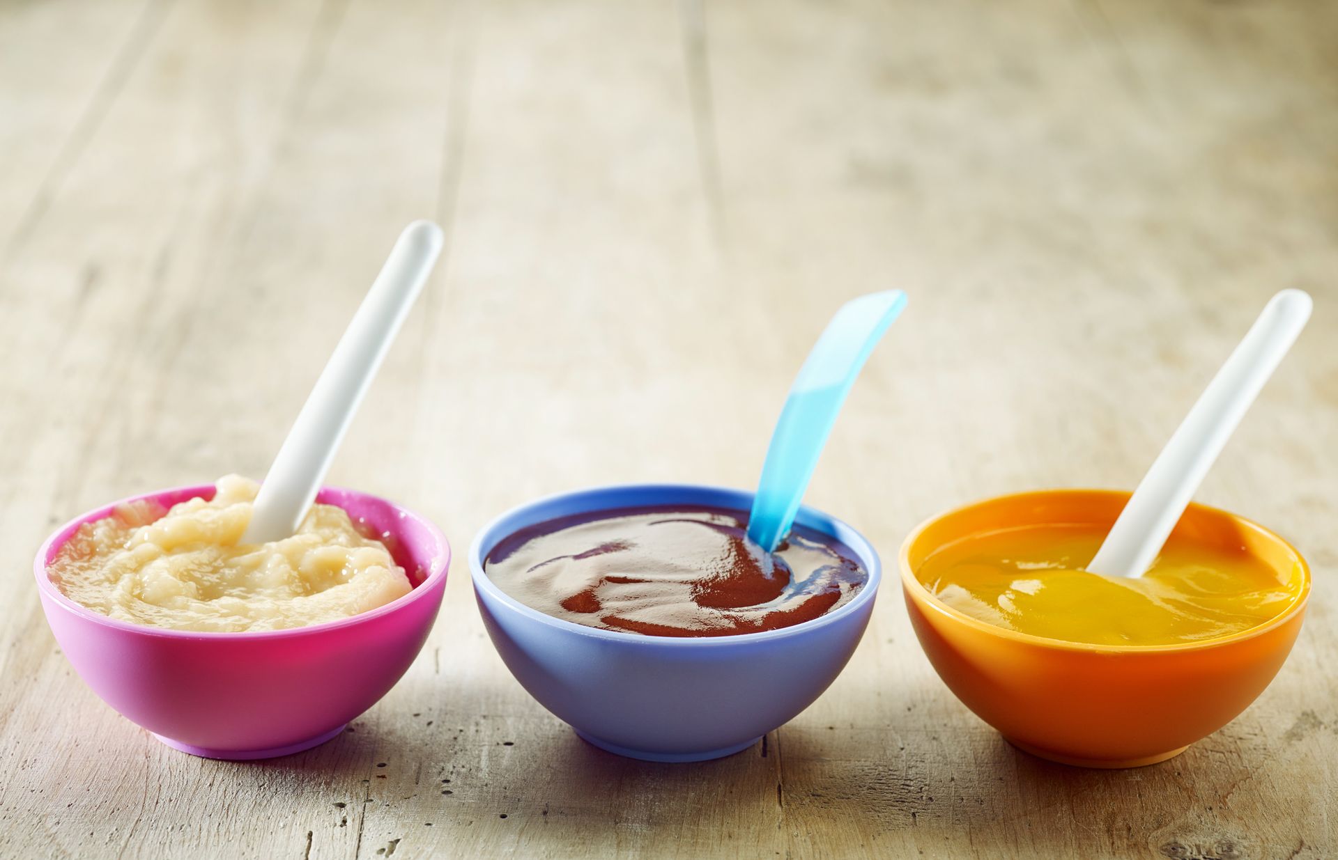 colorful bowls of baby food
