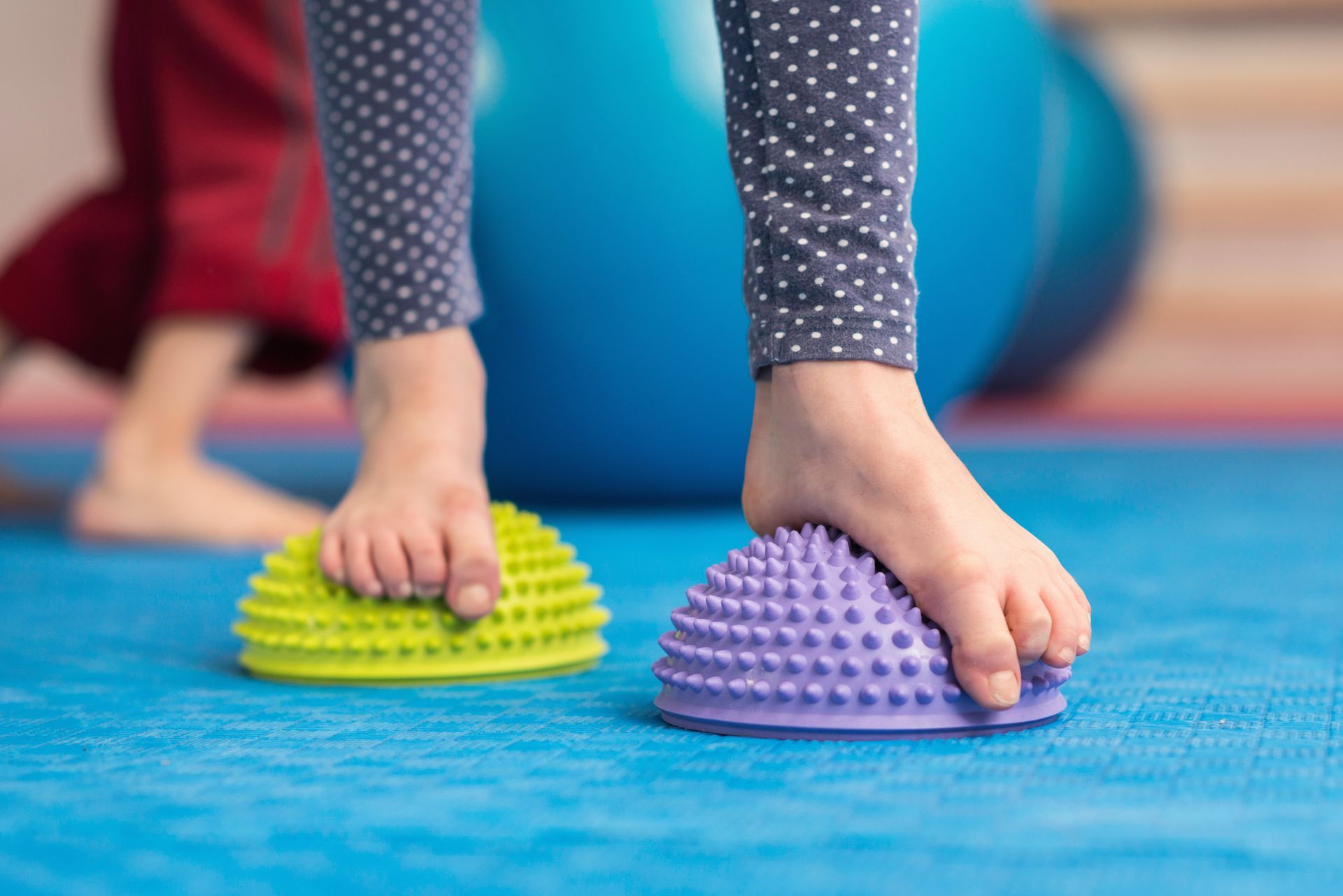 kids feet standing on soft rubber textured surface