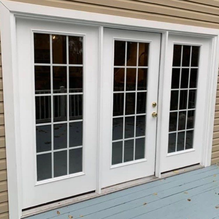 A pair of white sliding glass doors on a house