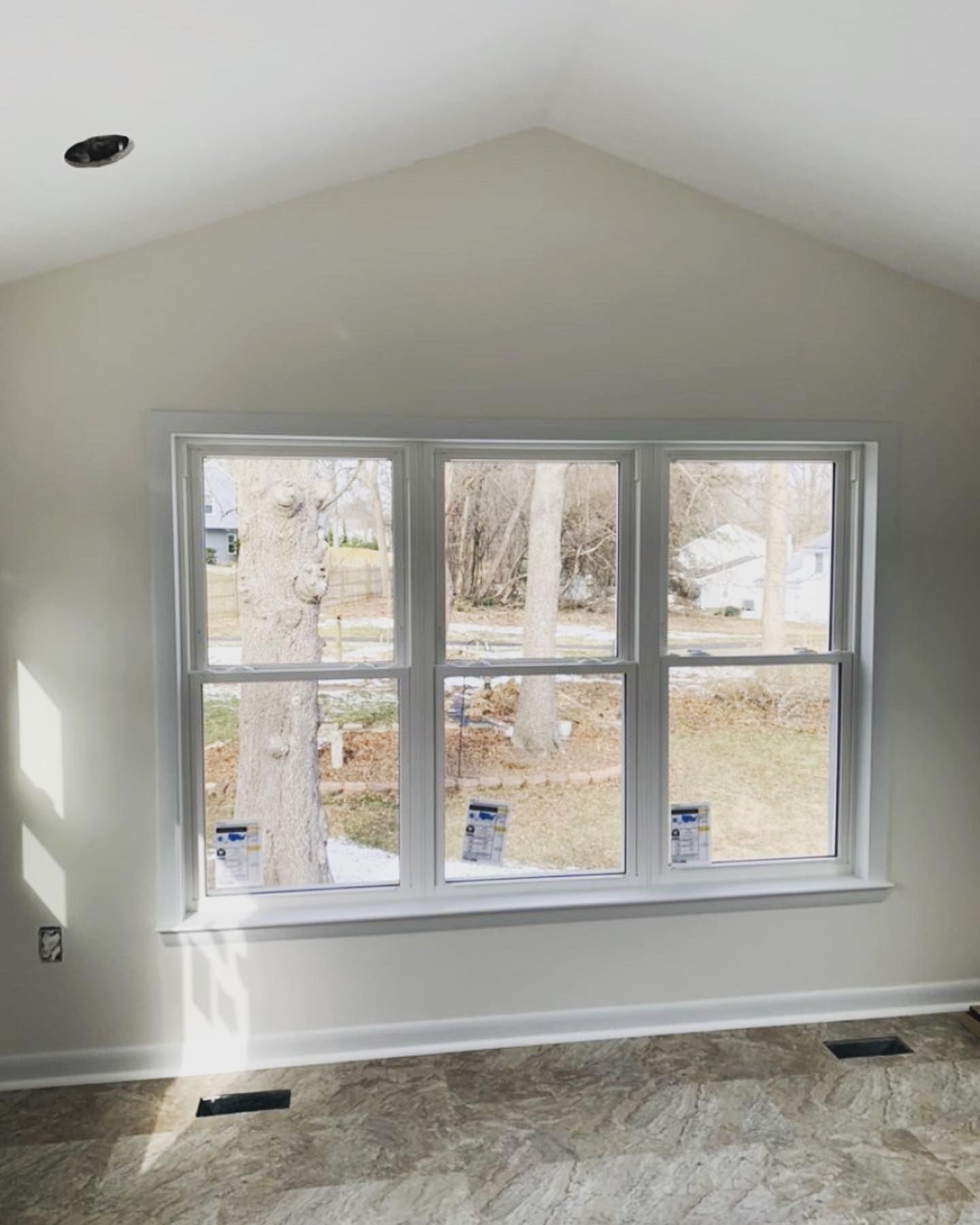 There is a large window in the middle of the room.