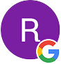 A purple circle featuring a white letter 