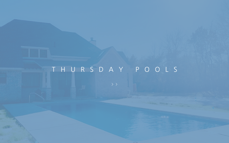 A rectangular swimming pool sits in front of a house, overlaid with a blue tint and the text 