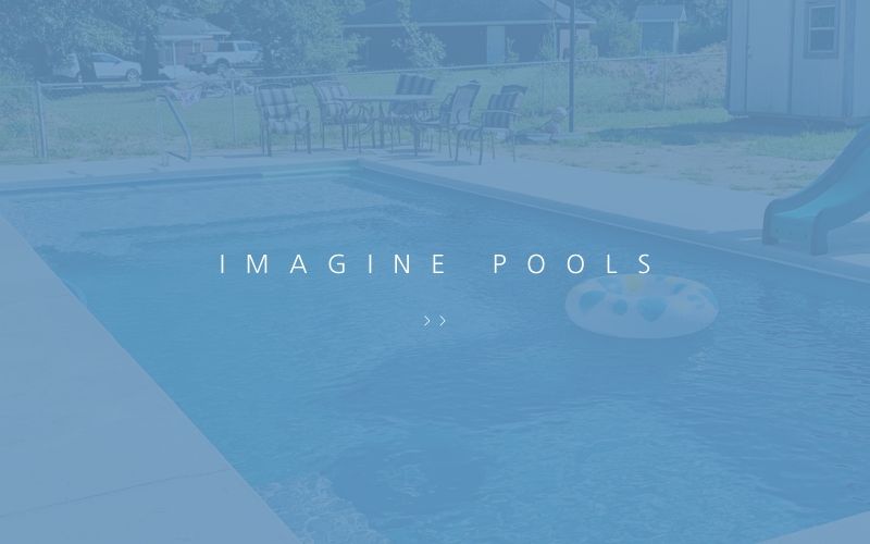A backyard swimming pool with a slide and floating ring, featuring the text 