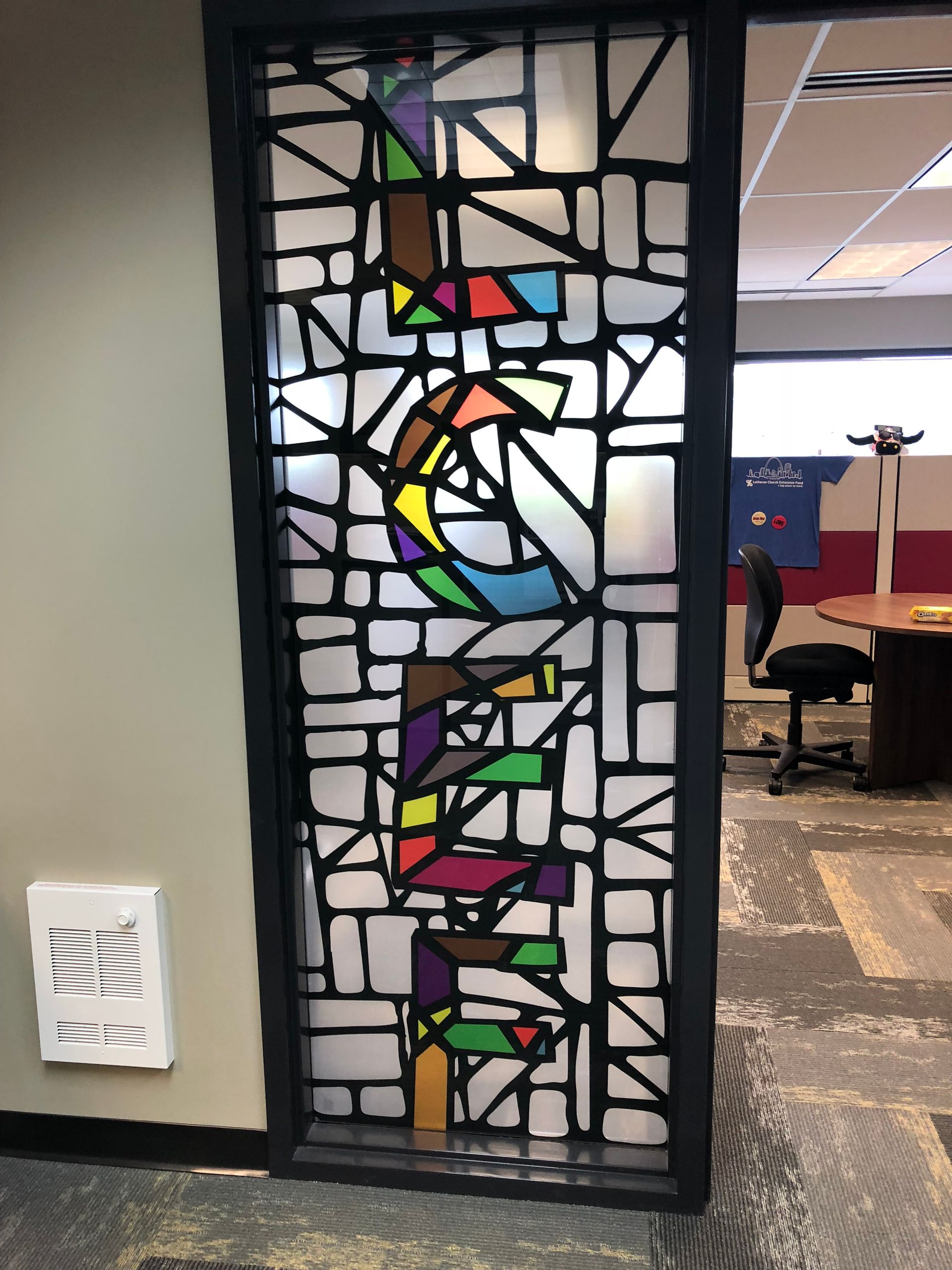 A stained glass window with the word 