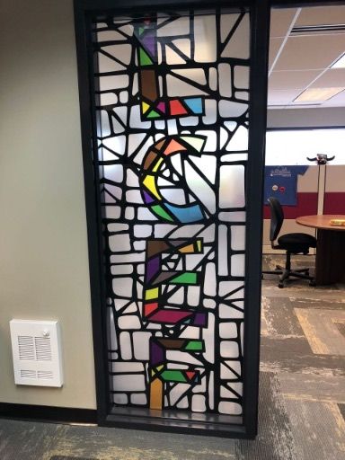 A stained glass window with the word 