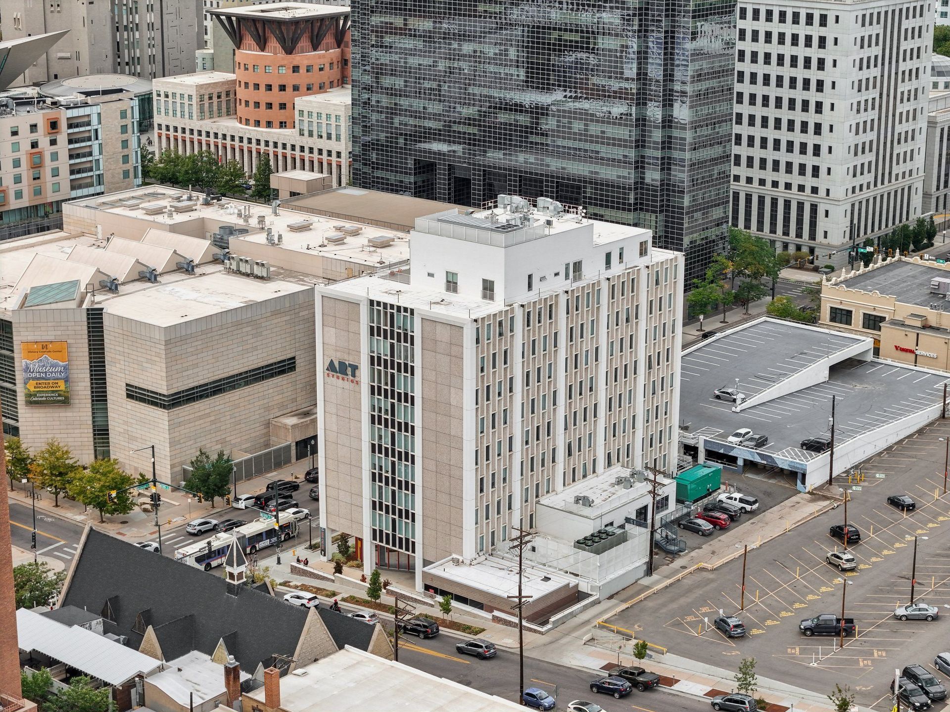 A cityscape with a large white building in the center.