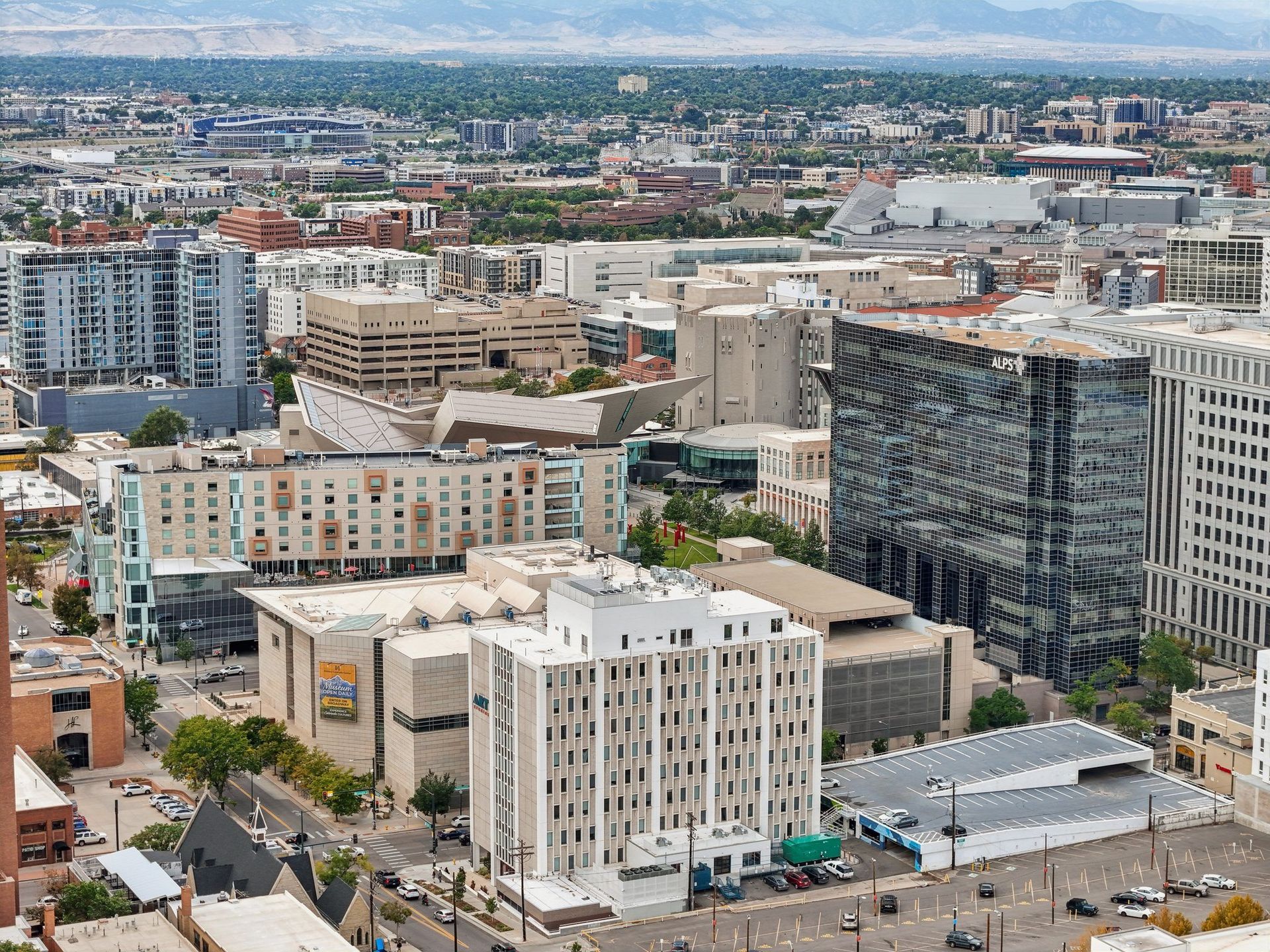 A cityscape with a mix of modern and older buildings.