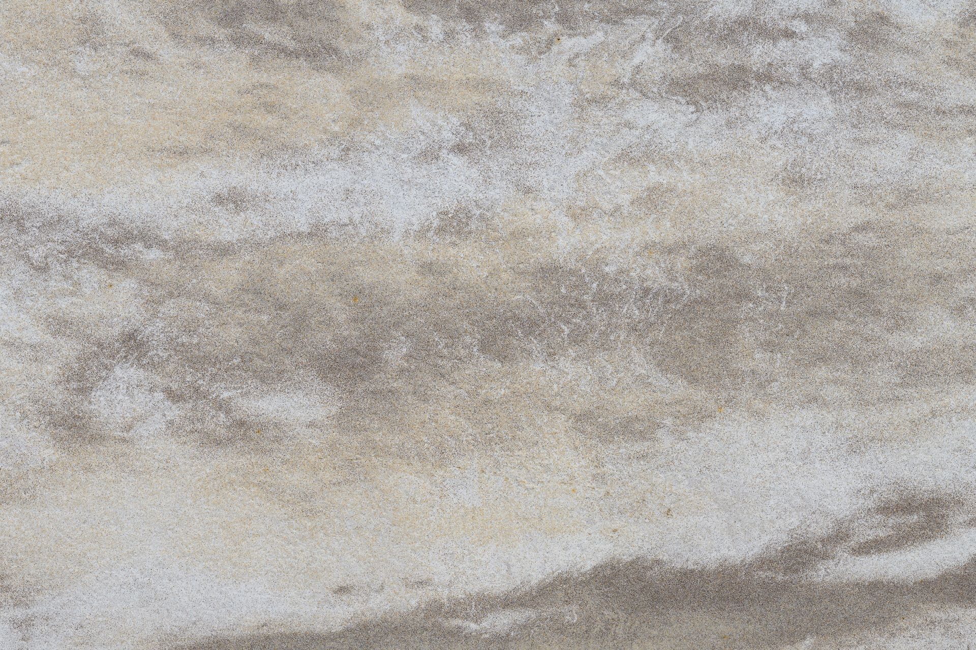 Textured surface with swirling patterns in shades of beige, gray, and brown.
