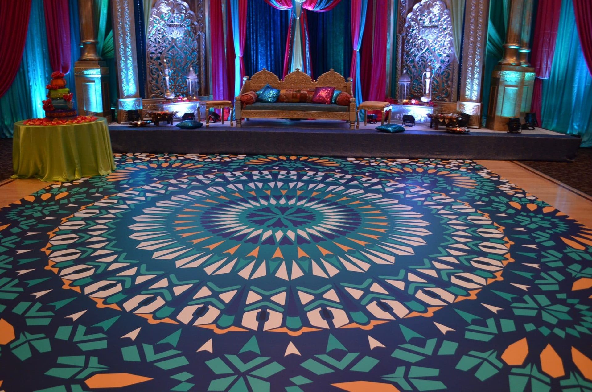 A colorful dance floor with a circular pattern on it