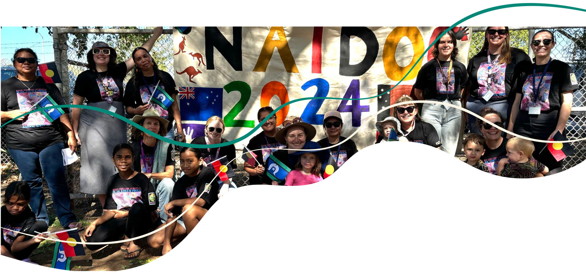 Group of people with a banner that reads