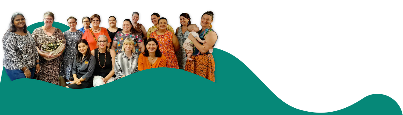 A group of people standing, some holding a baby, against a green wave background.