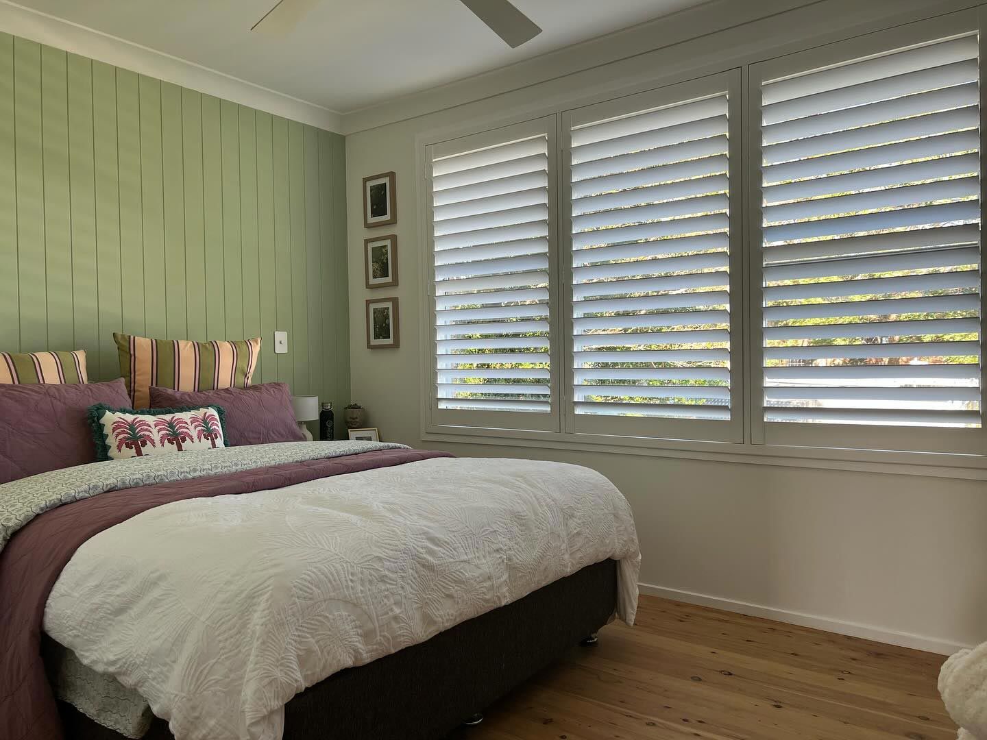 Bedroom With White Shutters