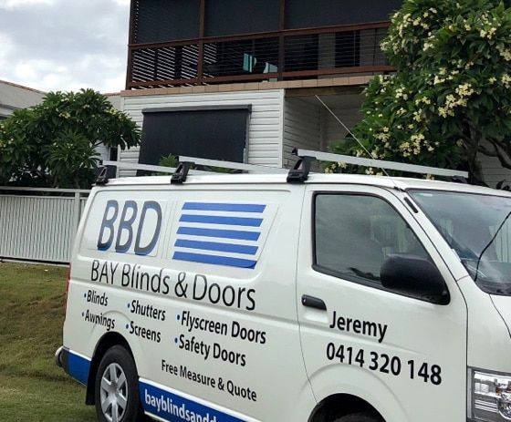 A Van for Bay Blinds and Doors Is Parked in Front of A House — Bay Blinds & Doors in Bateau Bay, NSW