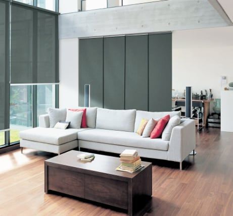 A Living Room with A Couch and A Coffee Table — Bay Blinds & Doors in Bateau Bay, NSW