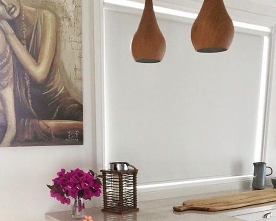 There Is a Painting of A Woman on The Wall Above the Counter — Bay Blinds & Doors in Toukley, NSW