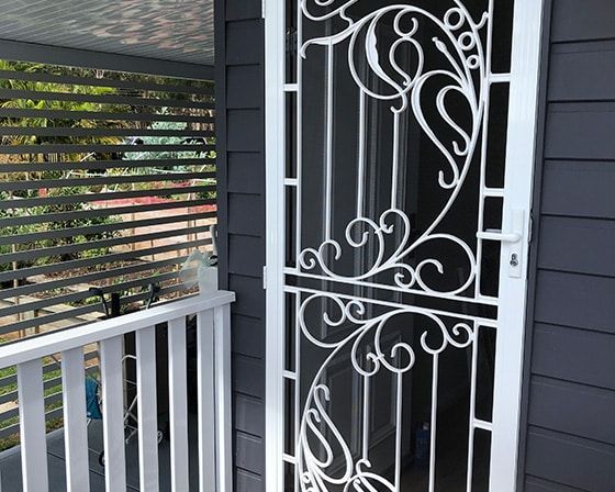 A House with A Swimming Pool in The Backyard — Bay Blinds & Doors in Bateau Bay, NSW