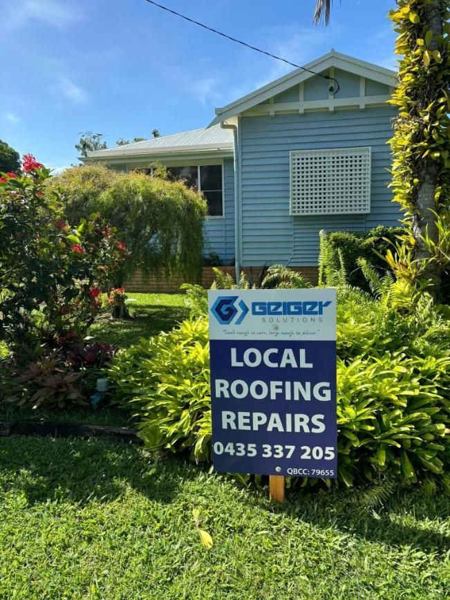 A Sign for Local Roofing Repairs is in Front of a House — Geiger Solutions In Mackay, QLD