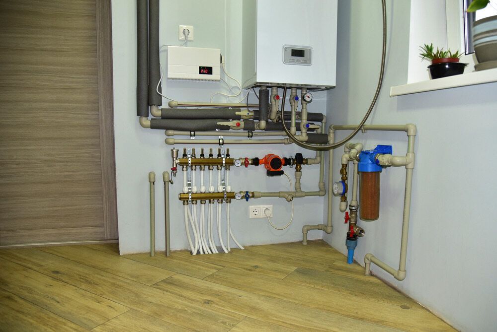 A Room With a Lot of Pipes and a Boiler on the Wall — Geiger Solutions In Bowen Basin, QLD