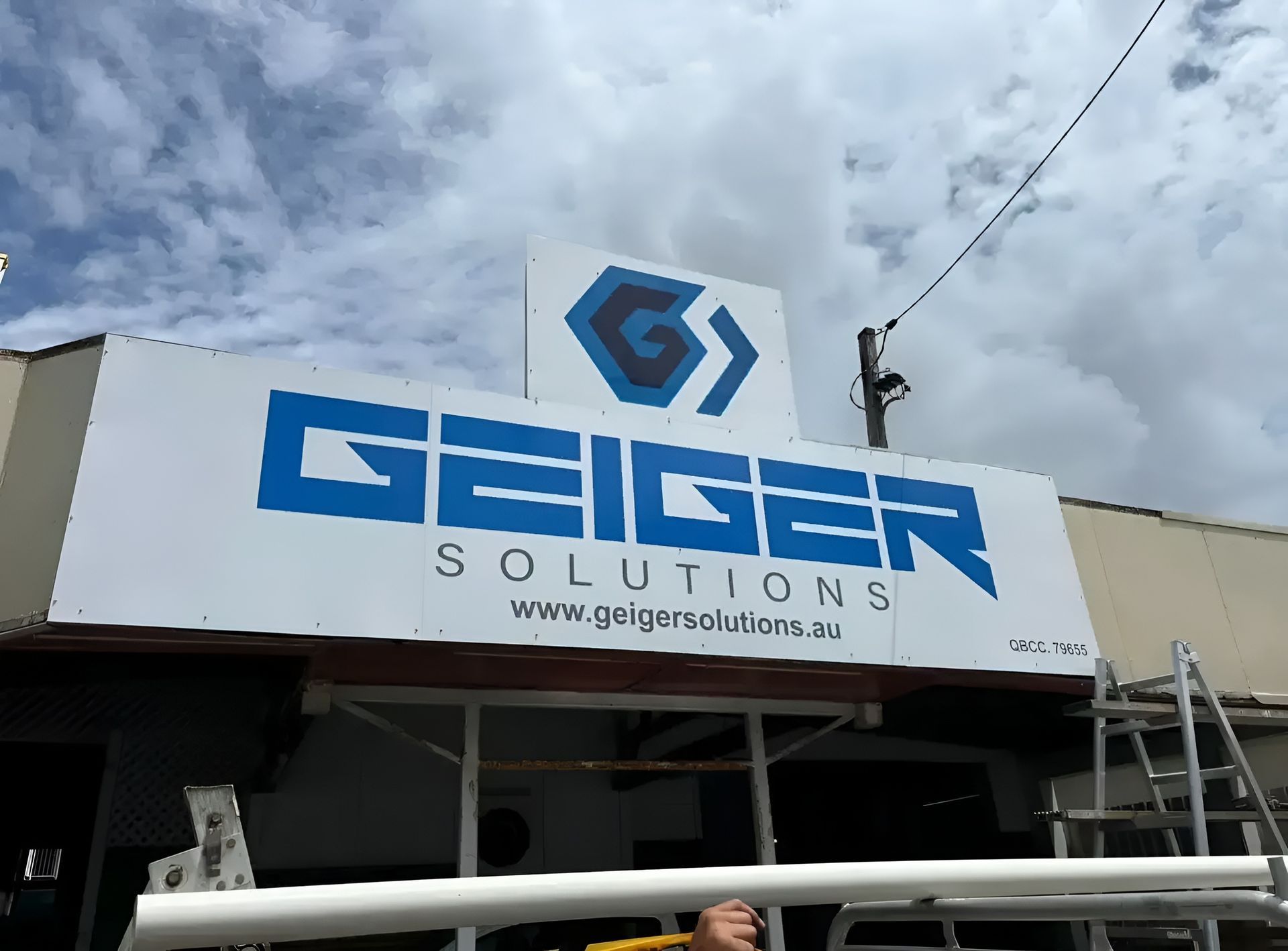 A Close Up of a Rusty Metal Wall With a Screw in It — Geiger Solutions In Mackay, QLD