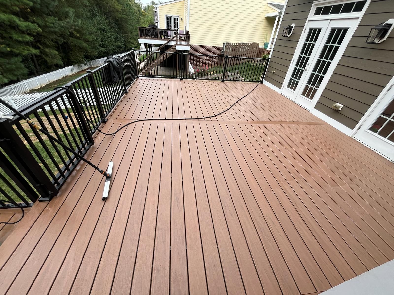 Trex composite deck in a popular 2025 color with modern railing design.