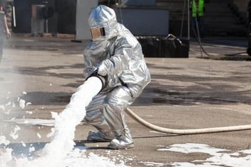 man spraying a foam insulation