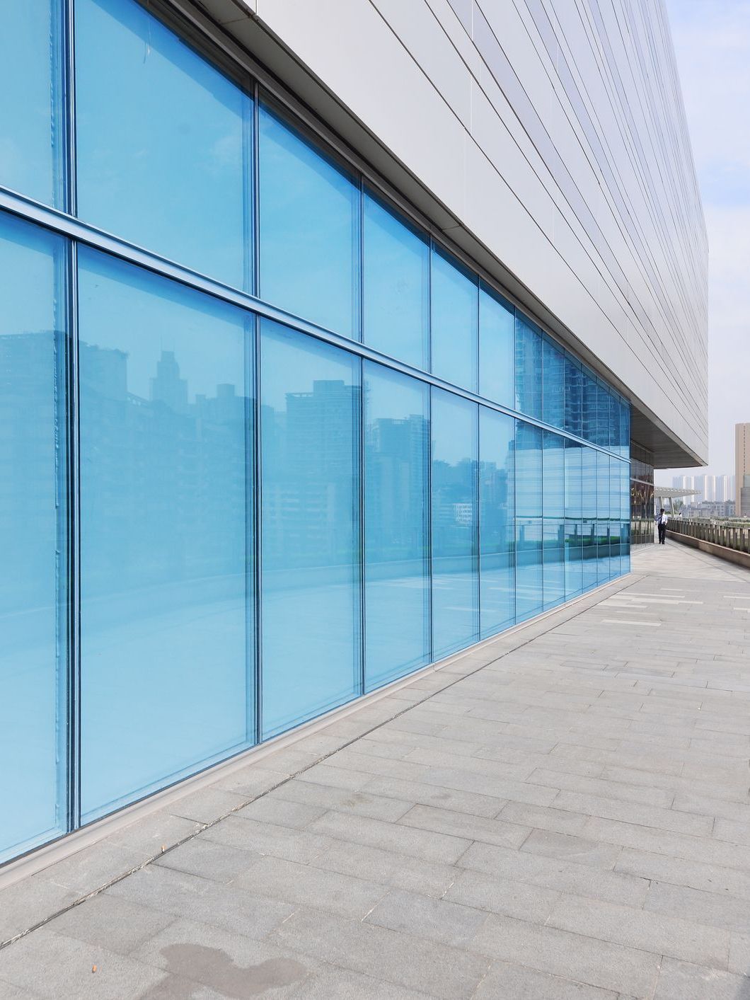 A large building with a lot of blue windows