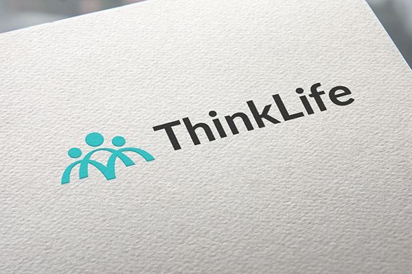 A close up of a thinklife logo on a piece of paper