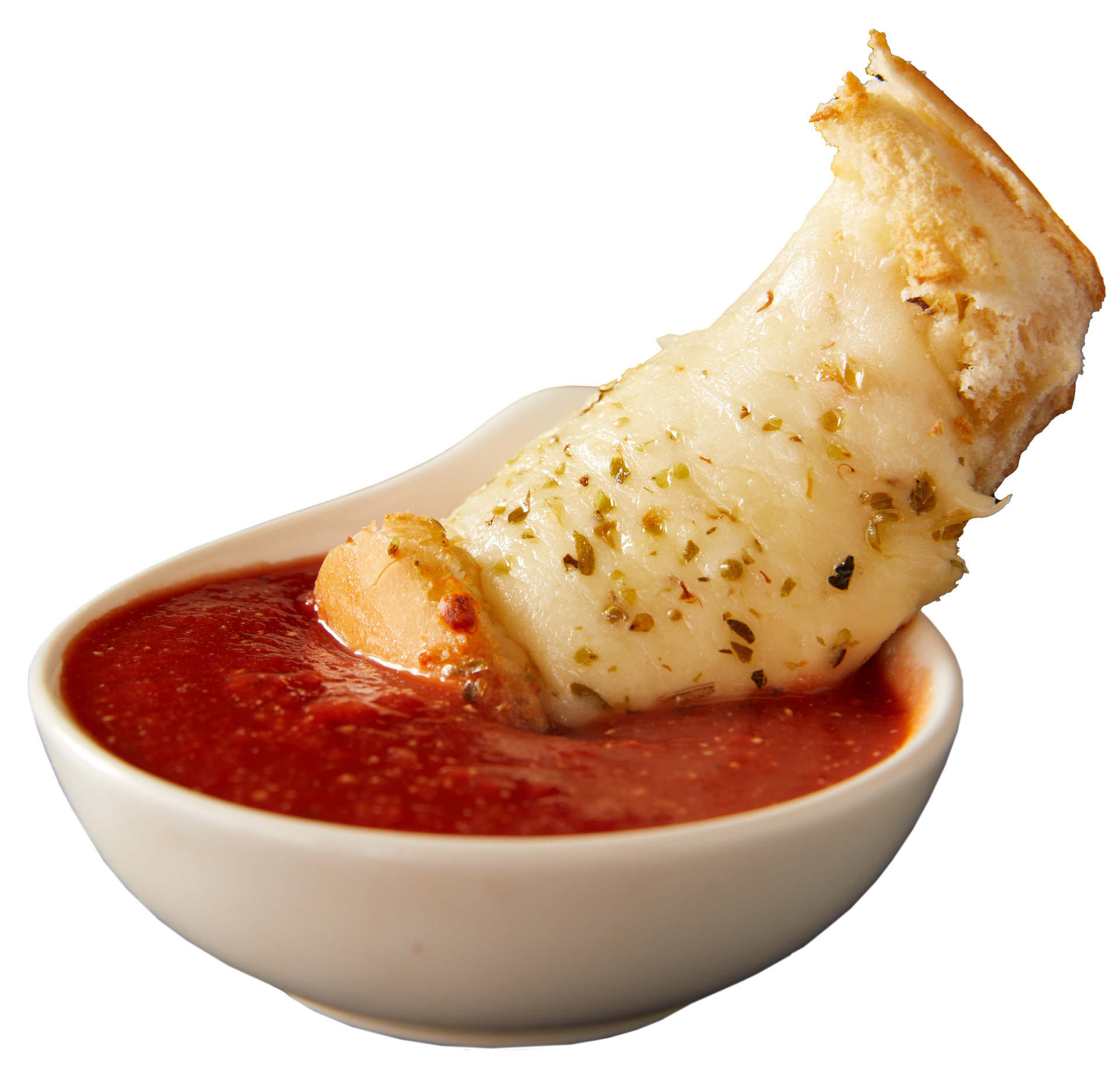 A piece of bread sticking out of a bowl of sauce