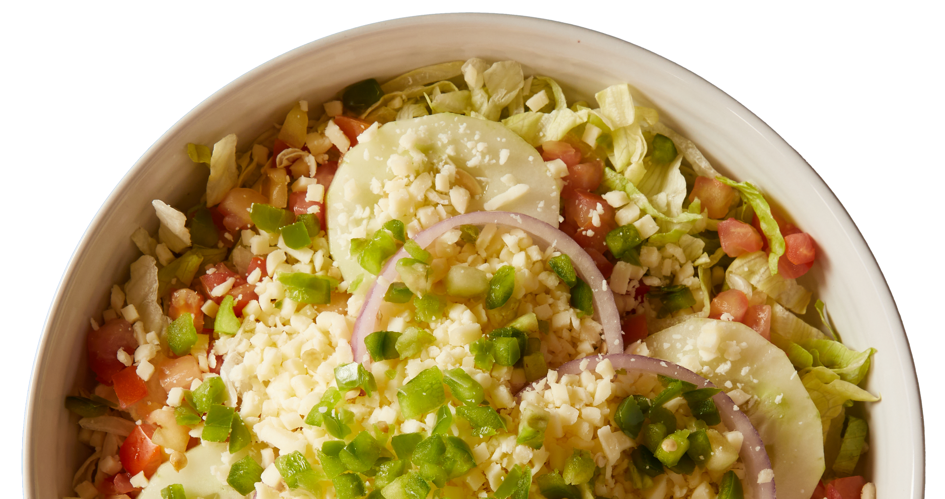 A close up of a salad in a bowl on a white background.