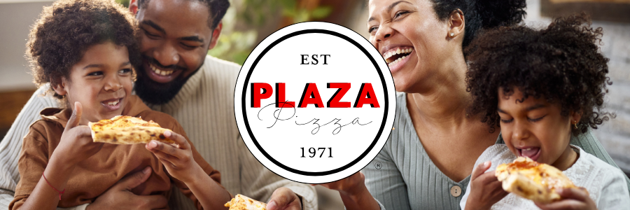 A family is sitting on a couch eating pizza.
