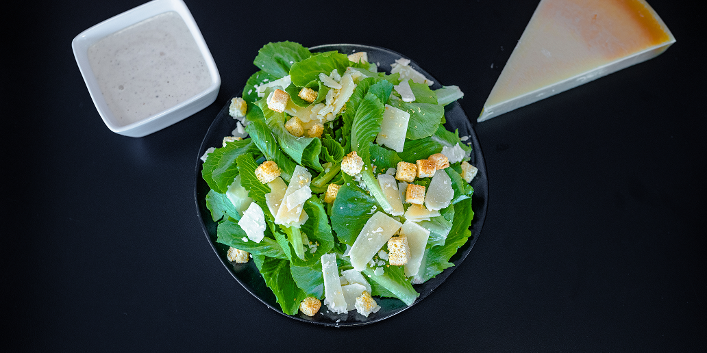 Crisp romaine lettuce tossed with shaved parmesan, crunchy croutons, and creamy Caesar dressing. Fresh, classic, and satisfying.