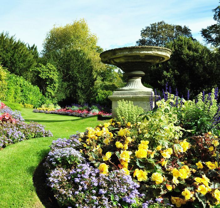 A Garden With Flowers and a Fountain in the Middle — Beerwah Co-Op in Beerwah, QLD