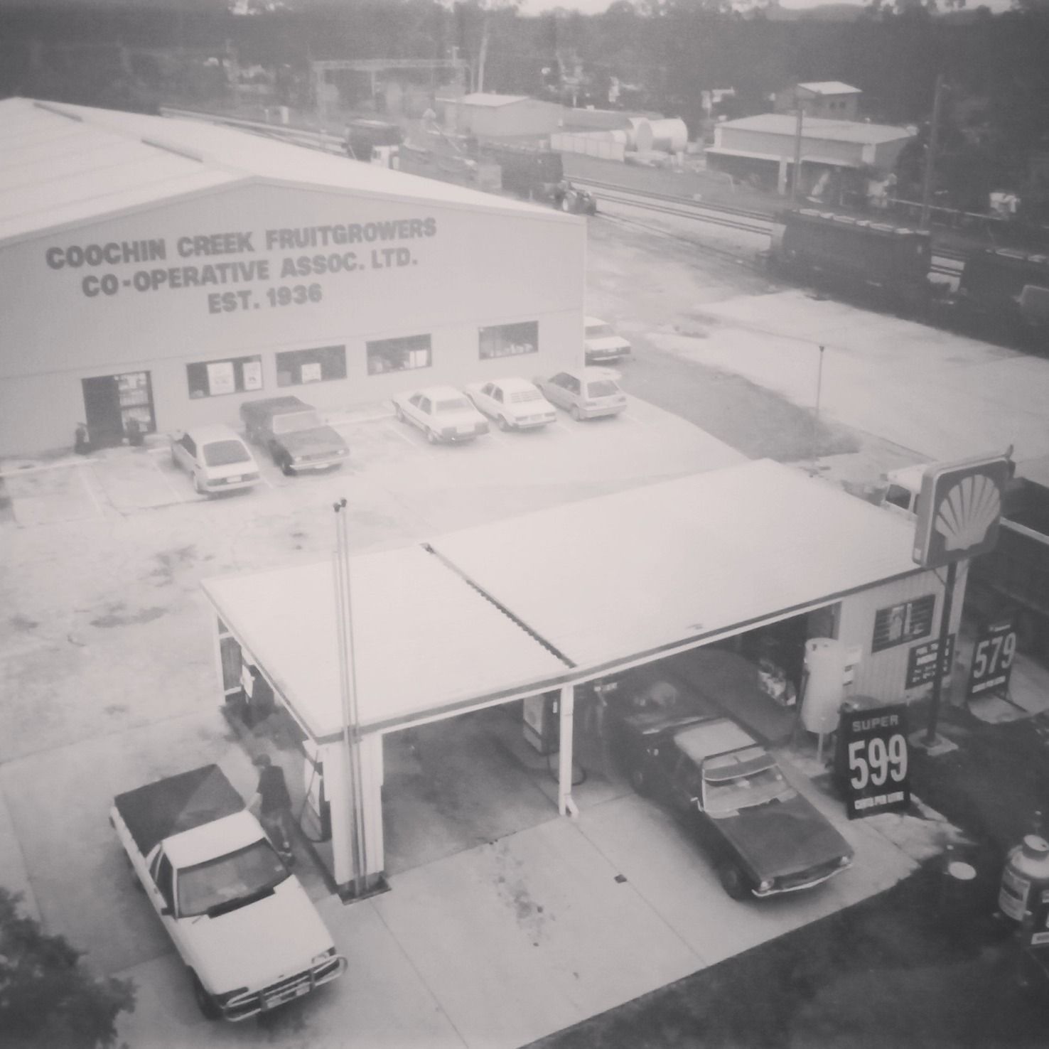 A black and white photo of a co-operative association gas station — Beerwah Co-Op in Beerwah, QLD
