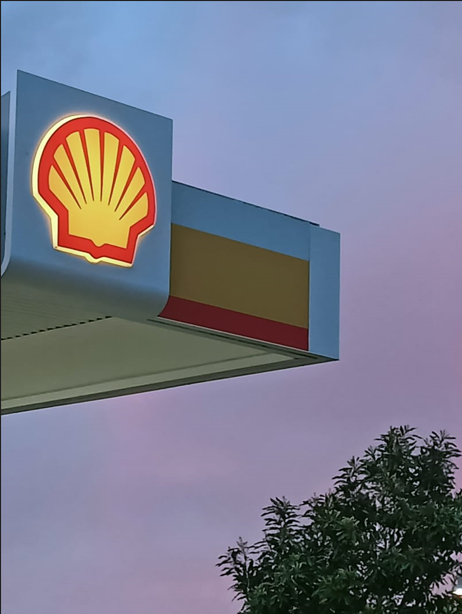 A gas station at night with a sunset in the background. — Beerwah Co-Op in Beerwah, QLD